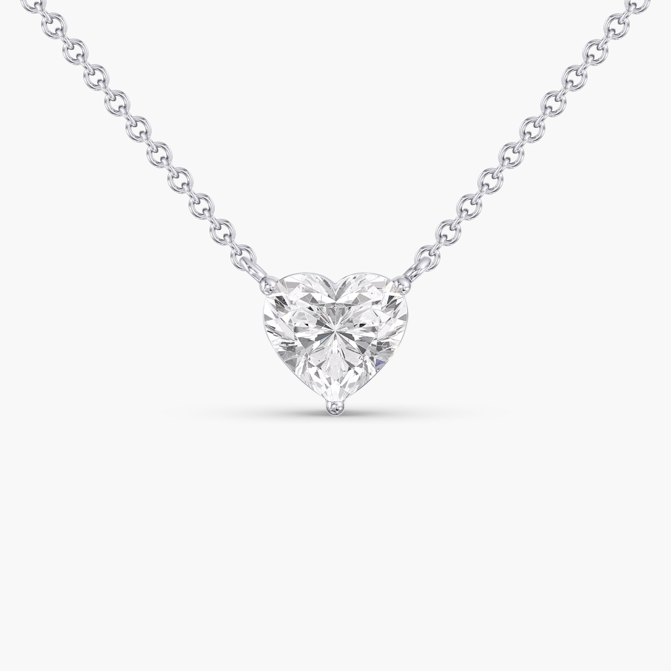 Heart-shaped diamond pendant necklace on fine white gold chain.
